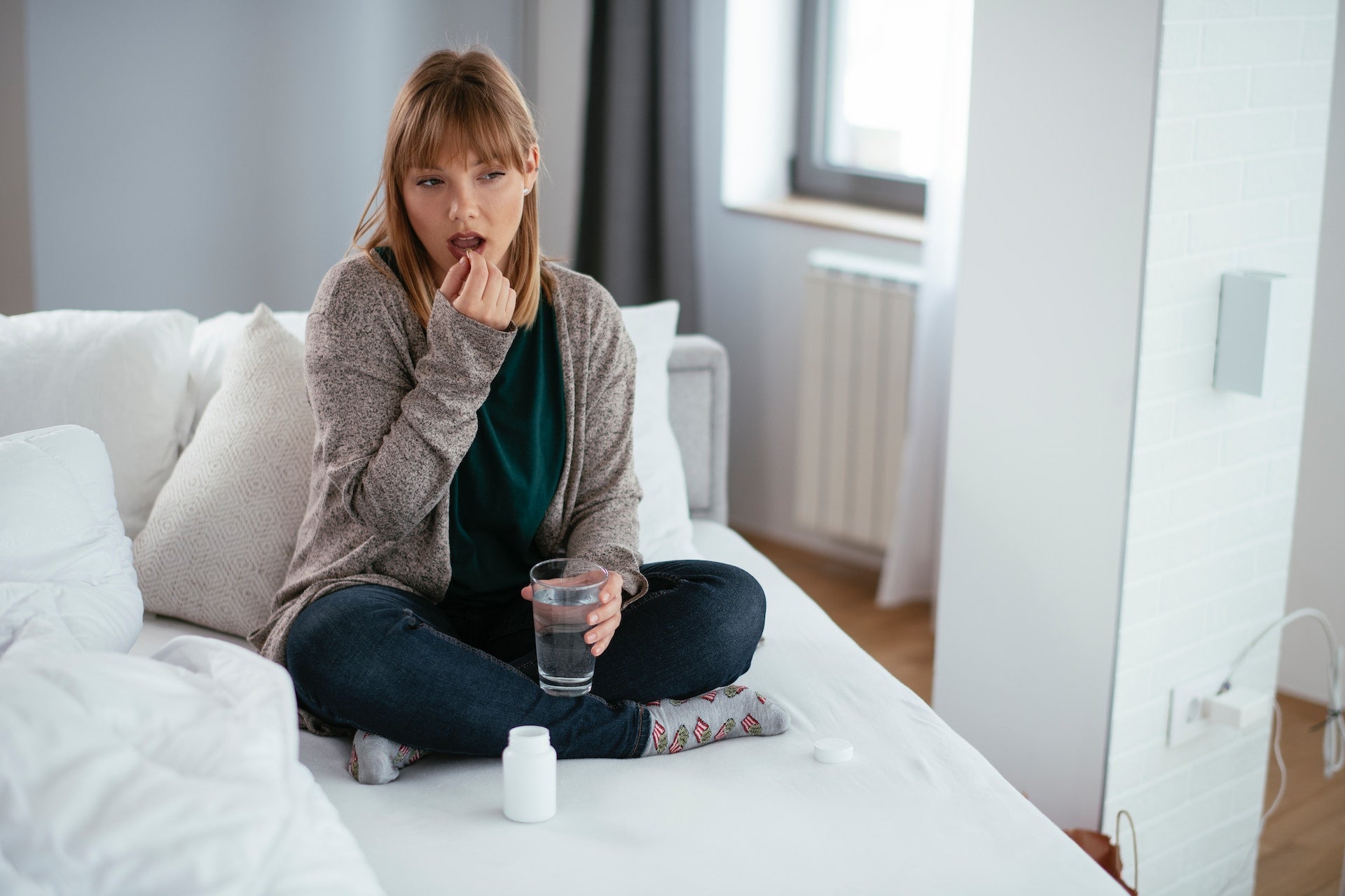 woman drinking supplement