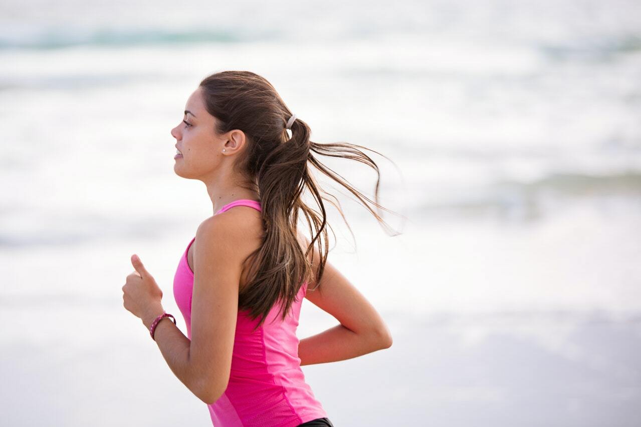 woman jogging at the beach